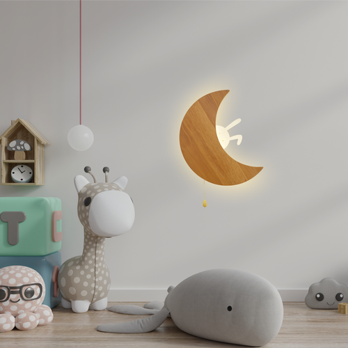 Wooden crescent moon wall lamp with a cute bunny detail glowing in a styled children’s nursery