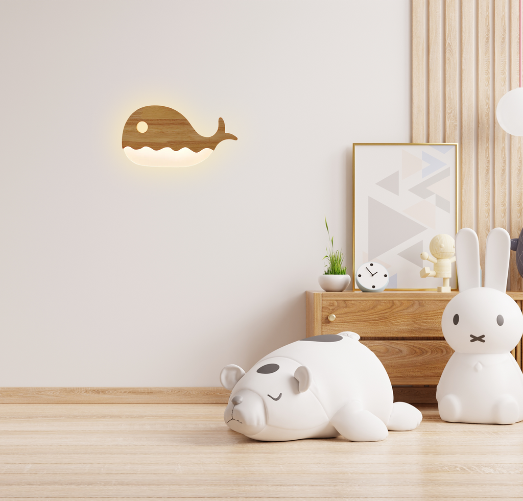Warm LED whale wall lamp adding soft ambient light to a modern children’s bedroom